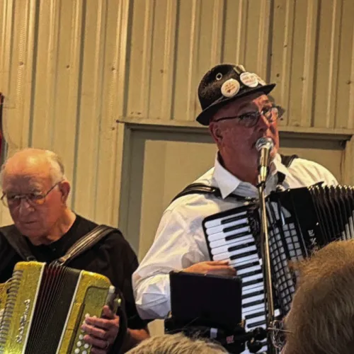 Alfred Vrazel and John Dujka on stage at the Vrazel Tribute concert in Cyclone on July 26.